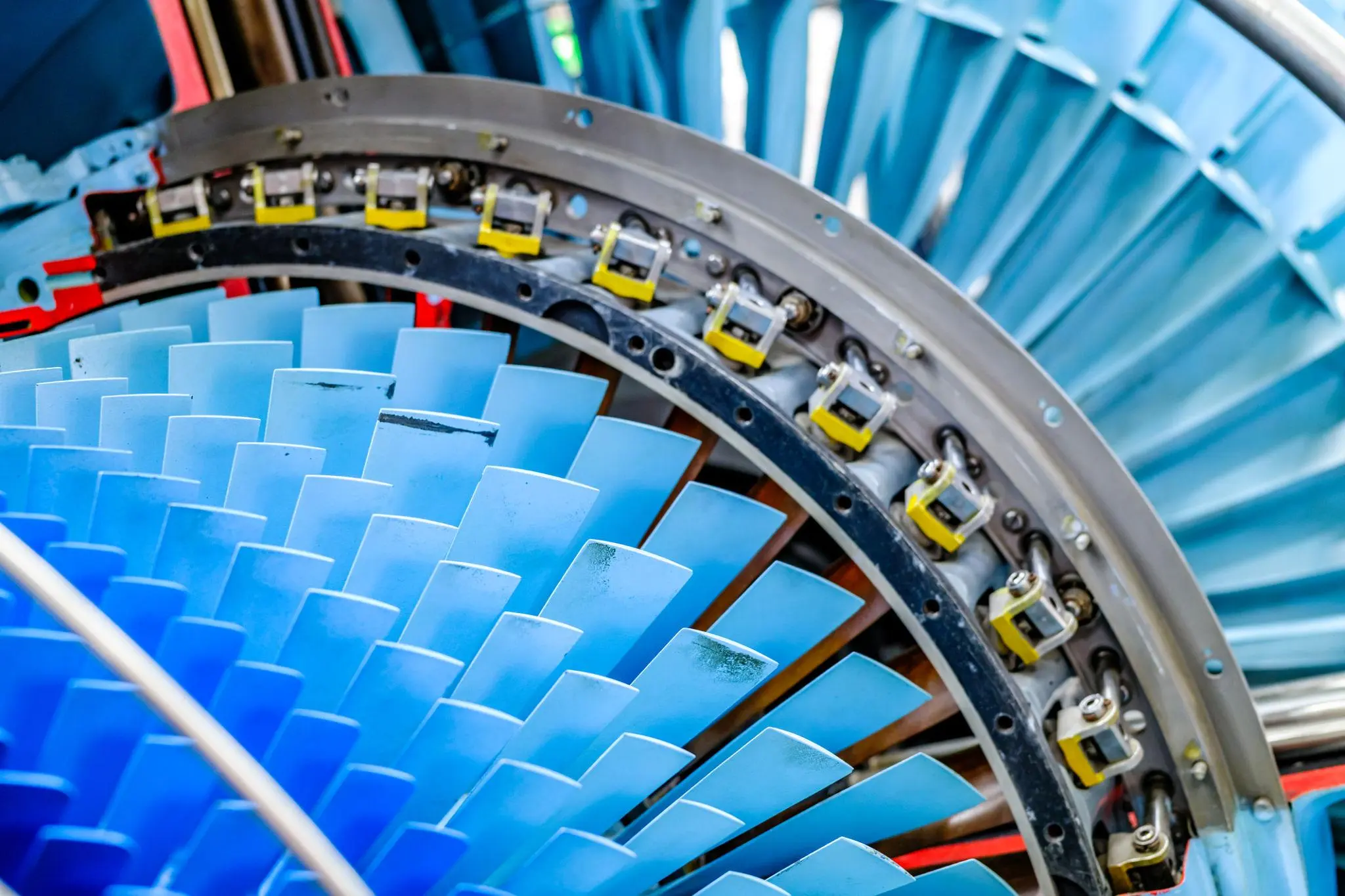Close-up of aircraft turbine blades inside a jet engine